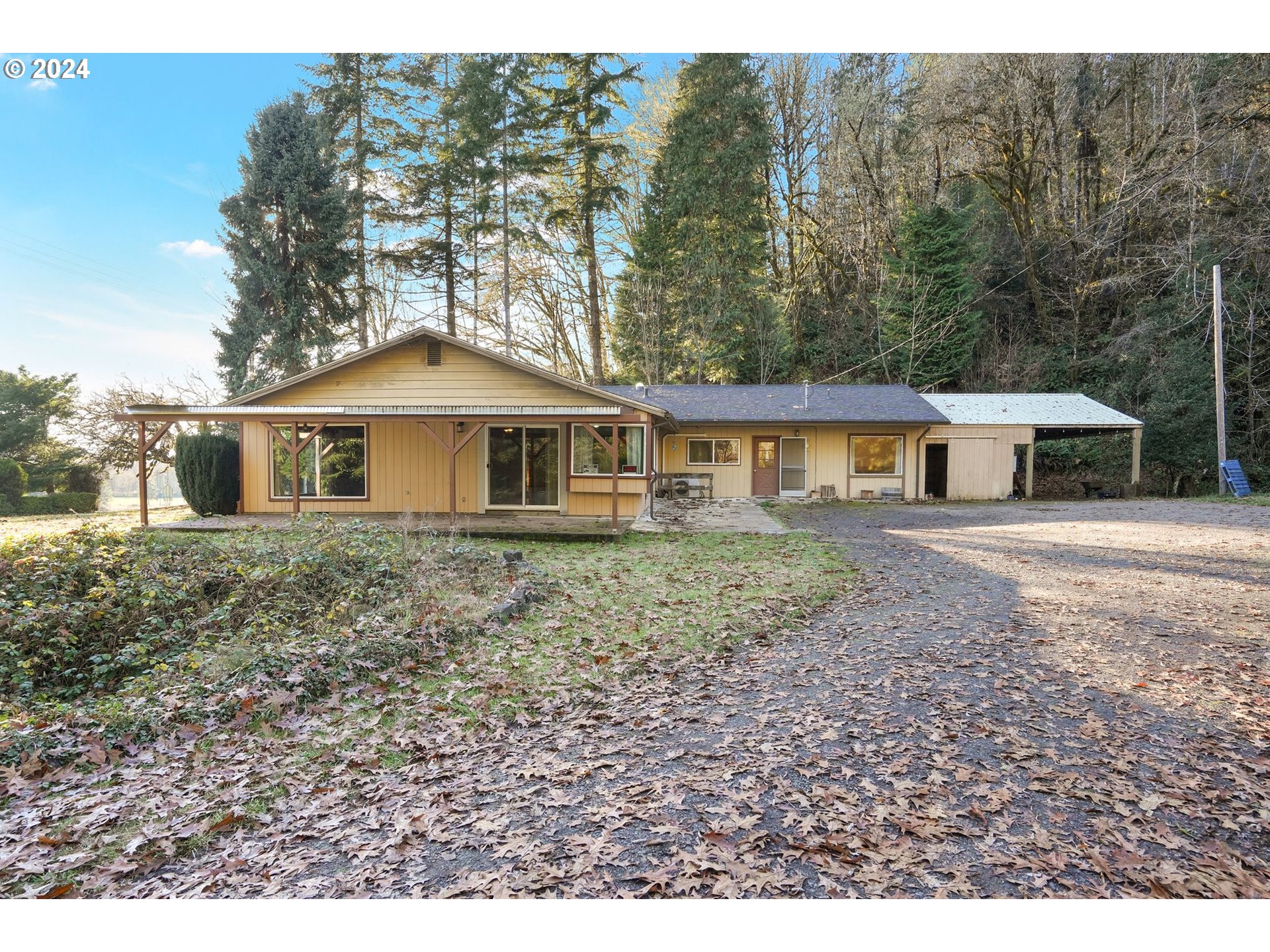 19237 Alsea Highway Alsea, OR 97324 - Photo 1 of 47 a front view of a house with a garden