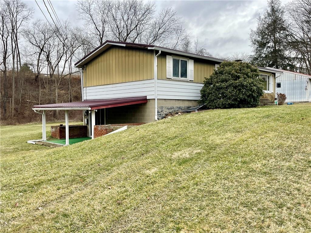 1305 Old State Road Apollo, PA 15613 - Photo 28 of 35 a front view of a house with a garden