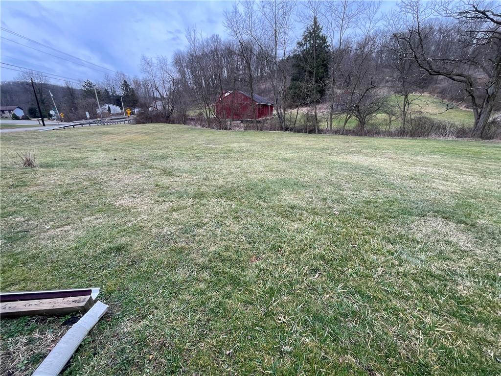 1305 Old State Road Apollo, PA 15613 - Photo 32 of 35 a backyard of apartments with trees