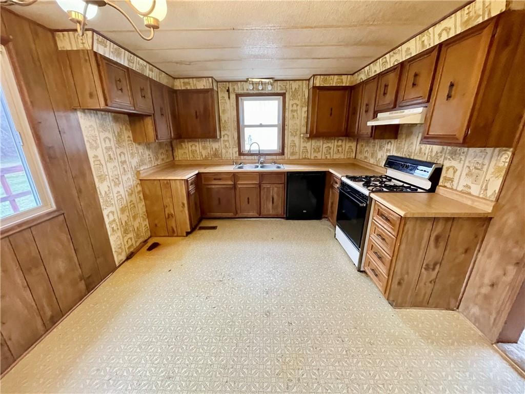 1305 Old State Road Apollo, PA 15613 - Photo 7 of 35 a kitchen with stainless steel appliances a stove a sink a refrigerator a sink a stove a microwave and cabinets