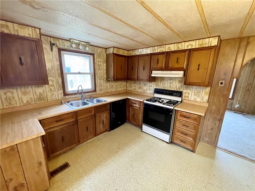 1305 Old State Road Apollo, PA 15613 - Photo 8 of 35 a kitchen with granite countertop a sink cabinets and stainless steel appliances