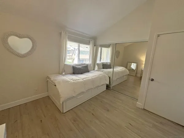 a bed room with a bed and a window