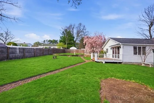 a view of house with a big yard