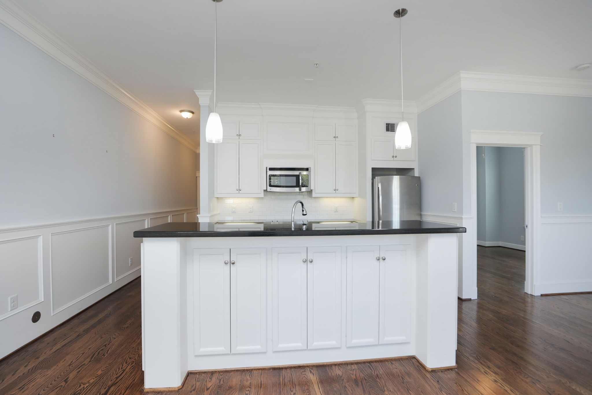 2802 Morrison Street, Unit 201 Houston, TX 77009 - Photo 11 of 50 a kitchen with granite countertop a sink and cabinets