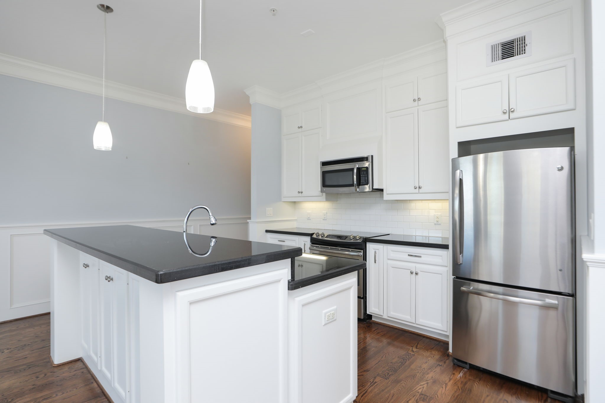 2802 Morrison Street, Unit 201 Houston, TX 77009 - Photo 15 of 50 a kitchen with stainless steel appliances granite countertop a sink stove and refrigerator