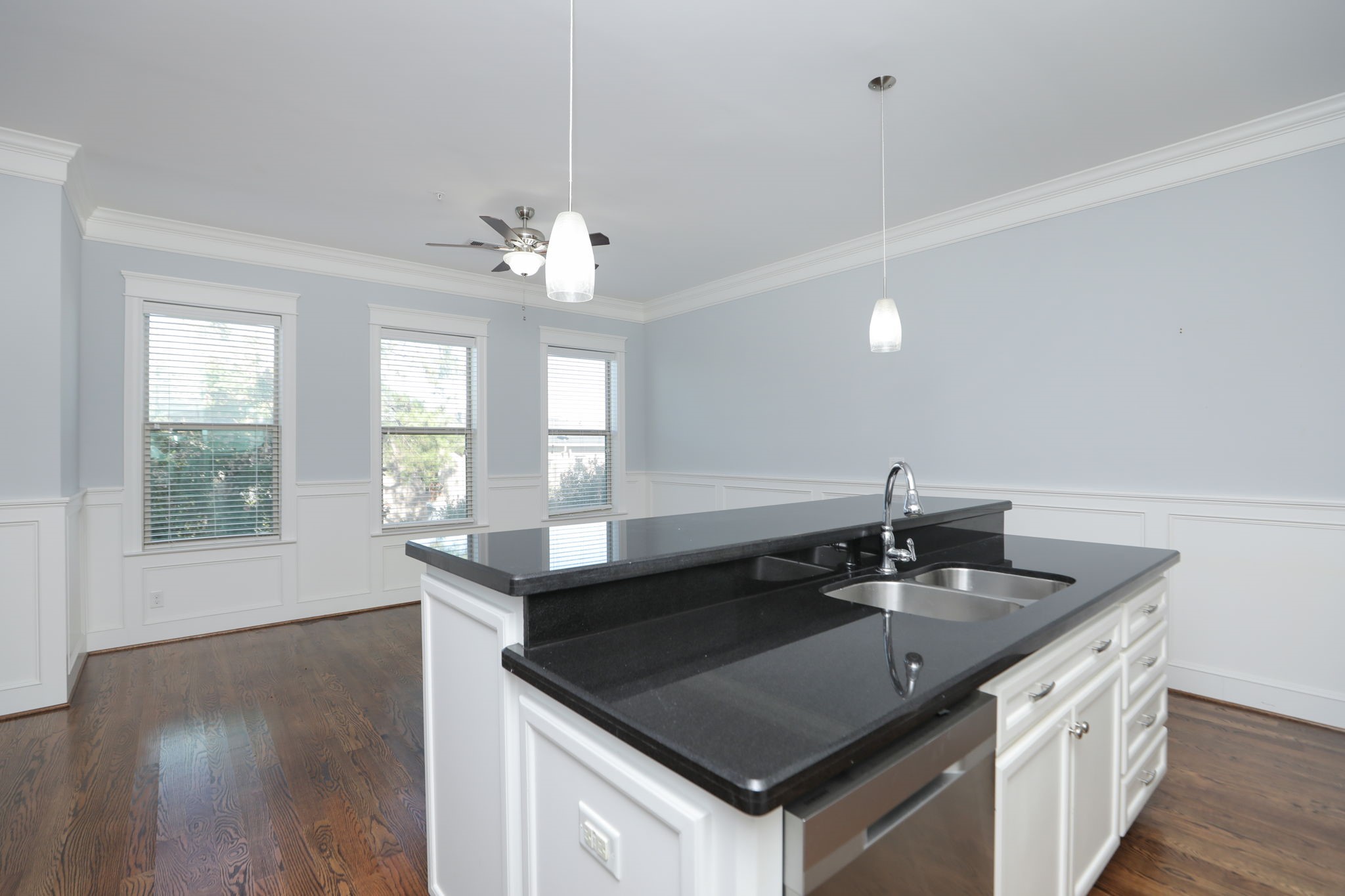 2802 Morrison Street, Unit 201 Houston, TX 77009 - Photo 18 of 50 a kitchen with granite countertop a sink a counter top space and cabinets