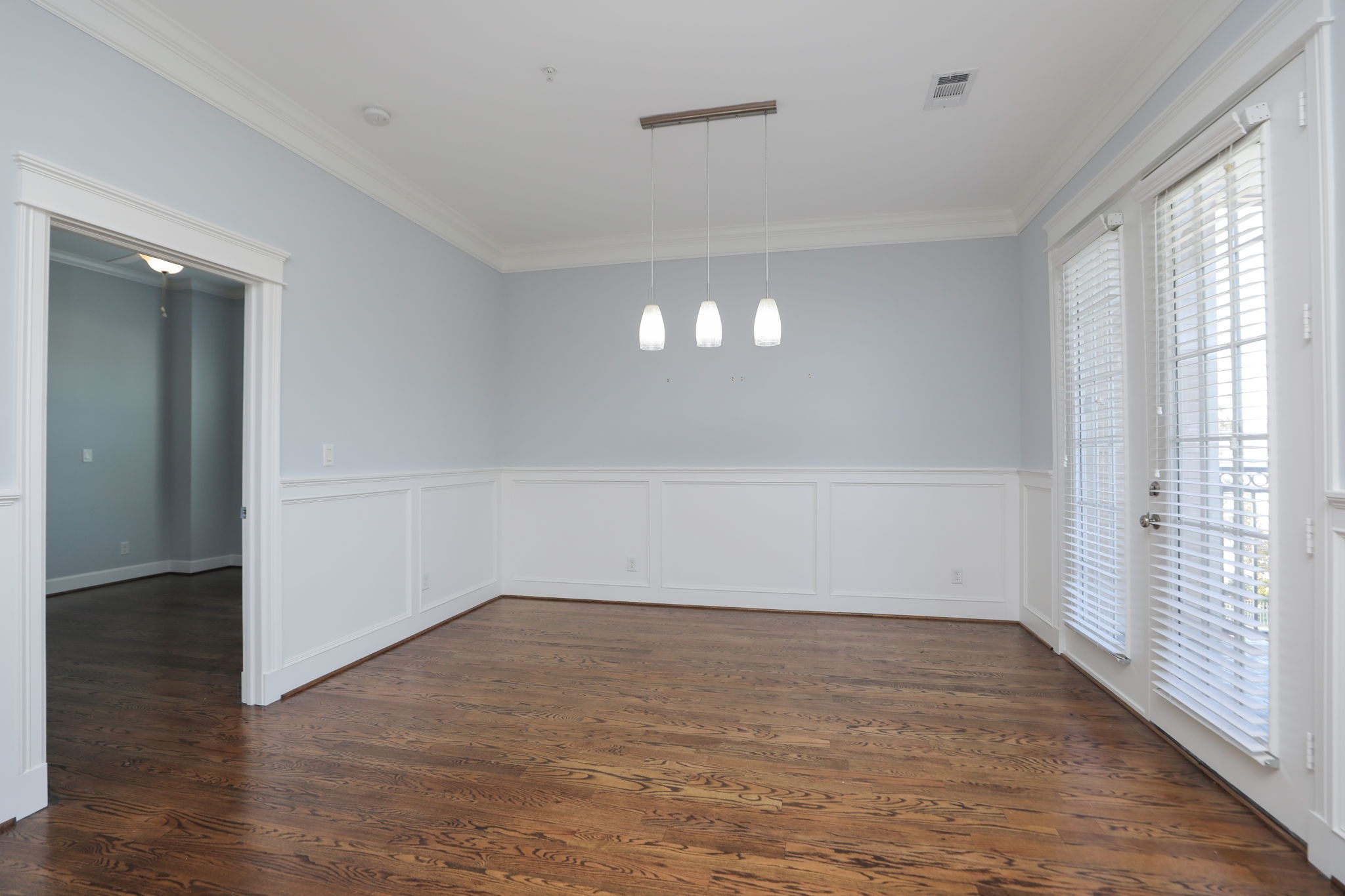 2802 Morrison Street, Unit 201 Houston, TX 77009 - Photo 20 of 50 wooden floor in an empty room with a window
