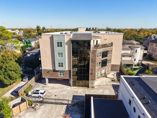 a view of a patio with table and chairs
