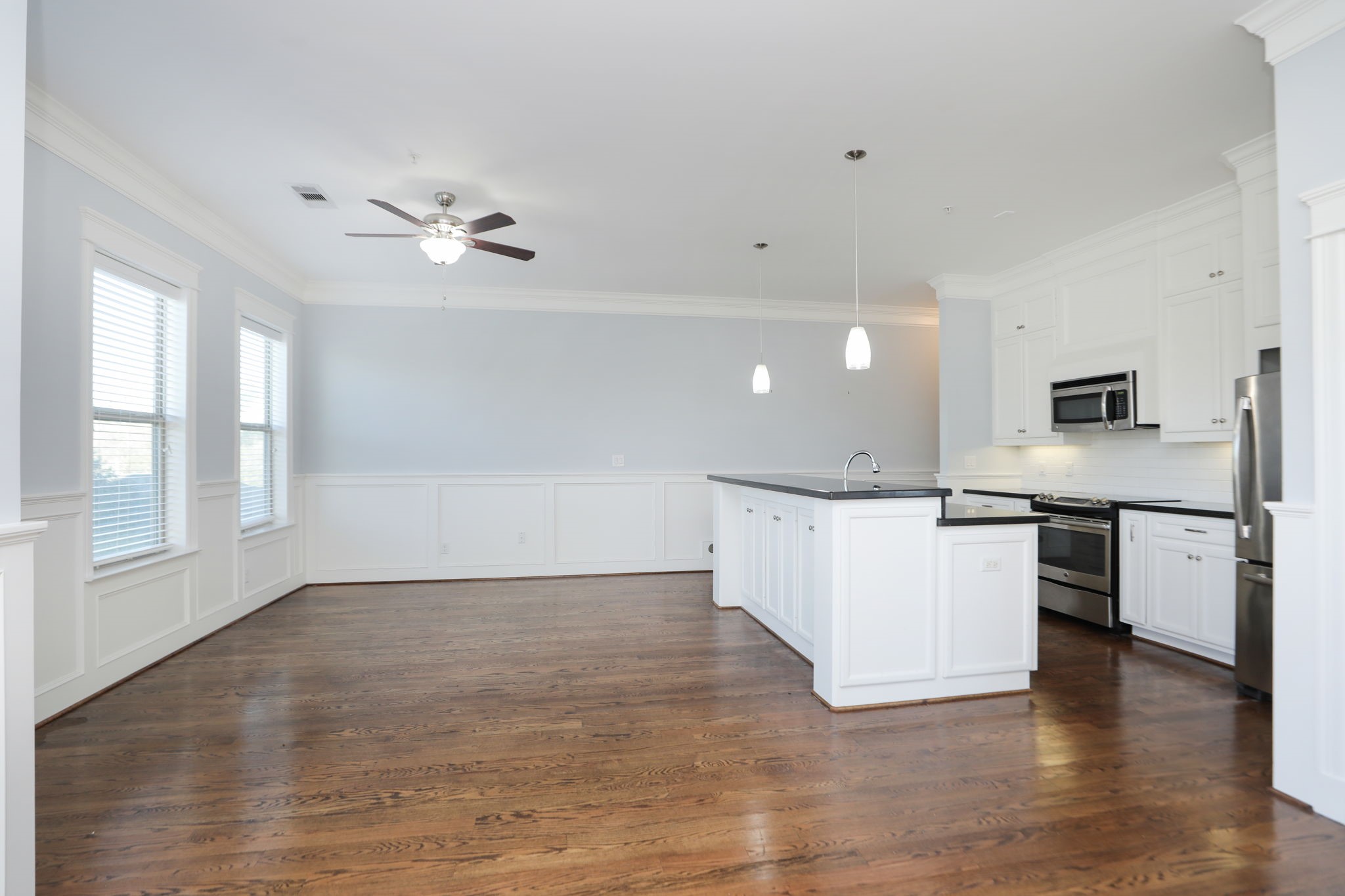 2802 Morrison Street, Unit 201 Houston, TX 77009 - Photo 23 of 50 a view of kitchen with a refrigerator wooden floor and a stove