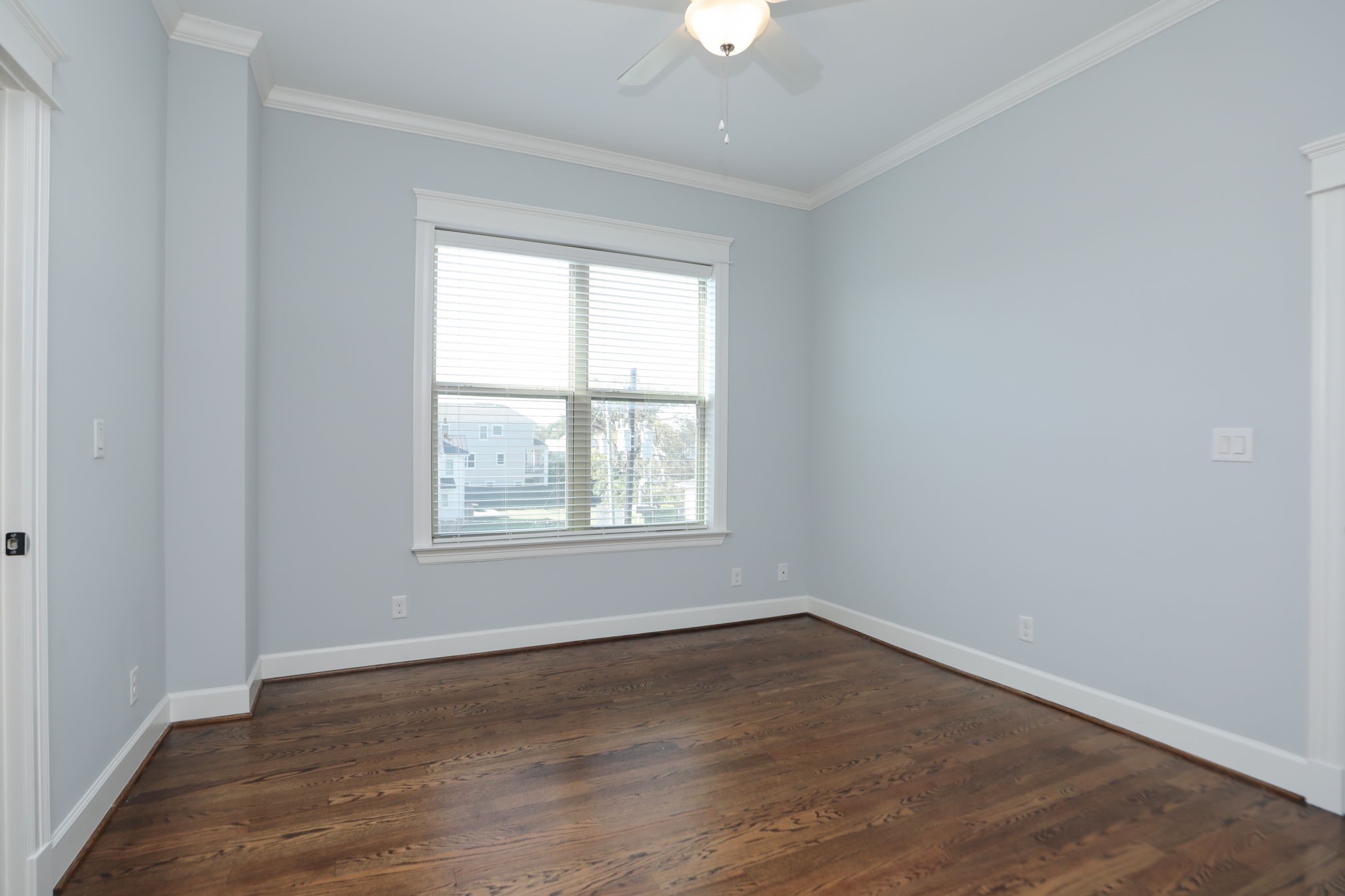 2802 Morrison Street, Unit 201 Houston, TX 77009 - Photo 28 of 50 an empty room with wooden floor and windows