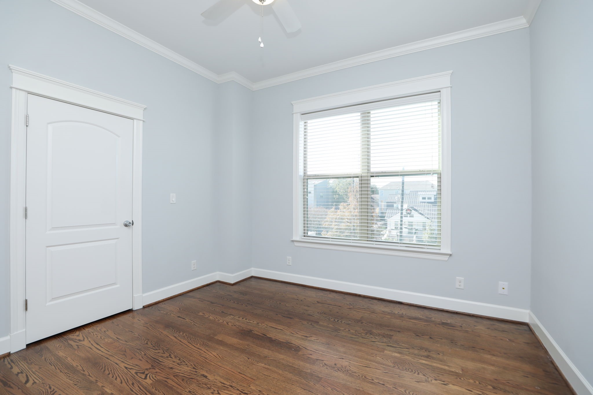 2802 Morrison Street, Unit 201 Houston, TX 77009 - Photo 29 of 50 an empty room with wooden floor and windows