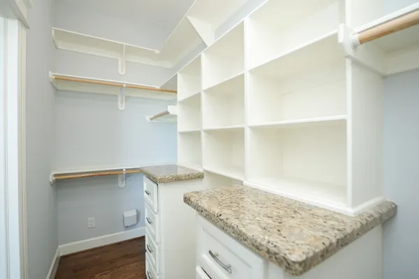 a view of cabinets with wooden floor
