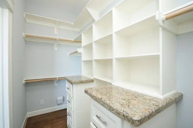 a view of cabinets with wooden floor