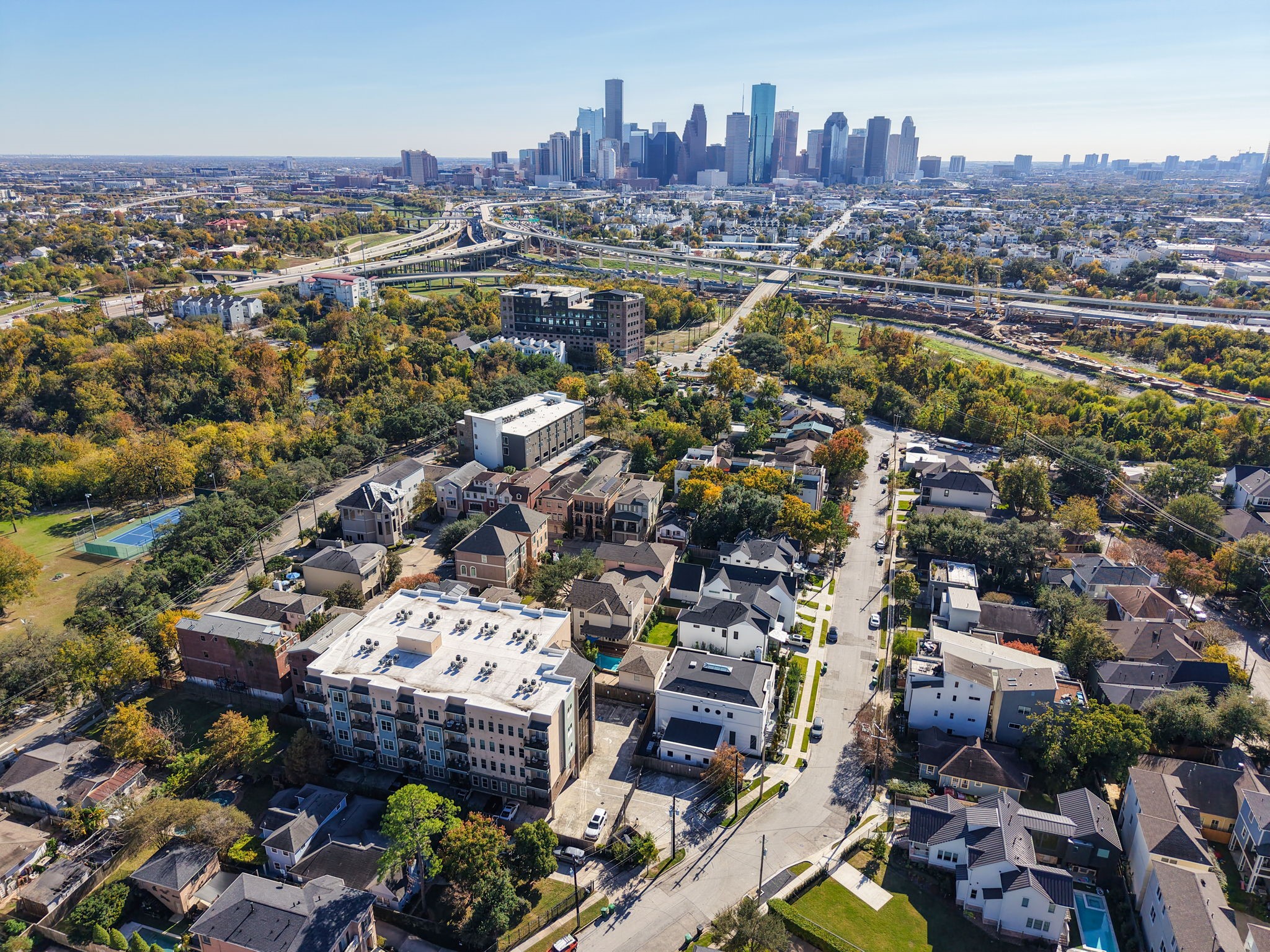 2802 Morrison Street, Unit 201 Houston, TX 77009 - Photo 50 of 50 an aerial view of a city with lots of residential buildings ocean and mountain view in back