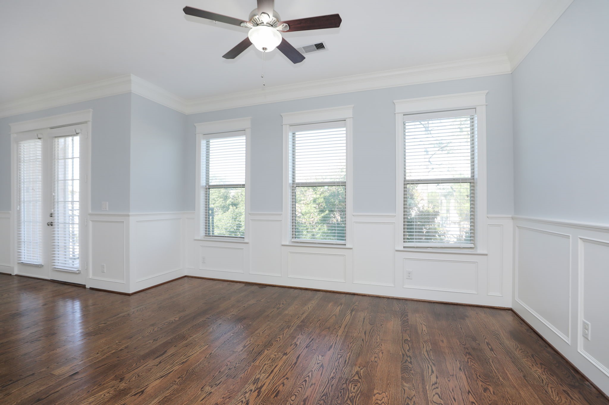 2802 Morrison Street, Unit 201 Houston, TX 77009 - Photo 7 of 50 a view of an empty room with wooden floor and a window