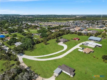an aerial view of a house with a garden