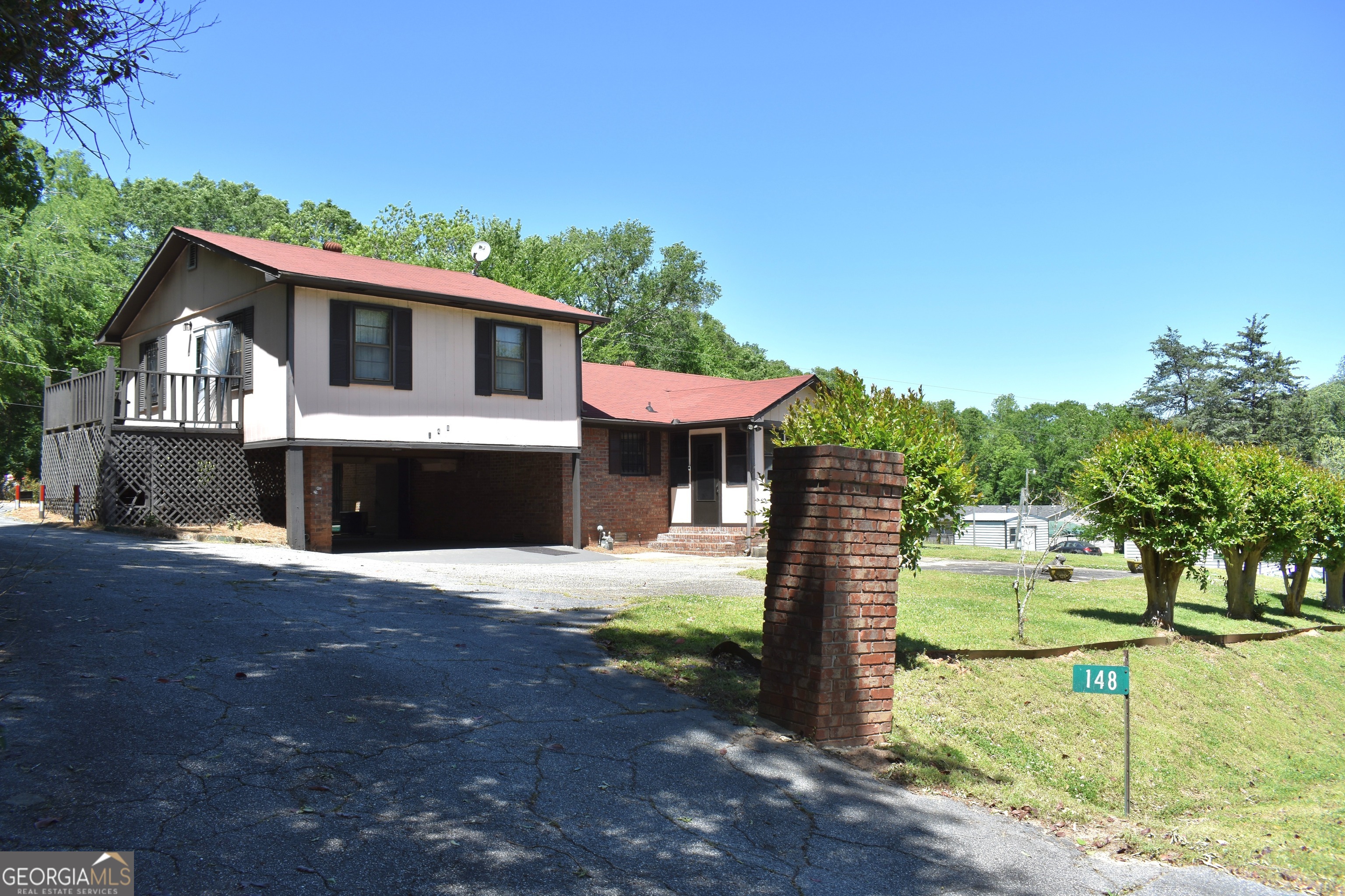 148 Upson Street Lexington, GA 30648 - Photo 12 of 12 a front view of a house with a yard and mountain view
