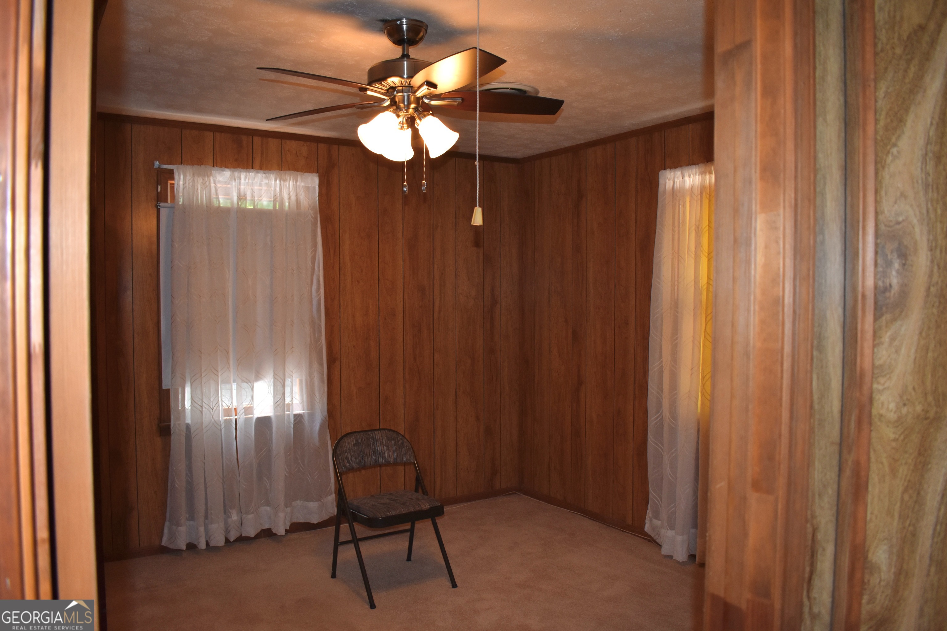 148 Upson Street Lexington, GA 30648 - Photo 8 of 12 a view of a livingroom with furniture and chandelier fan