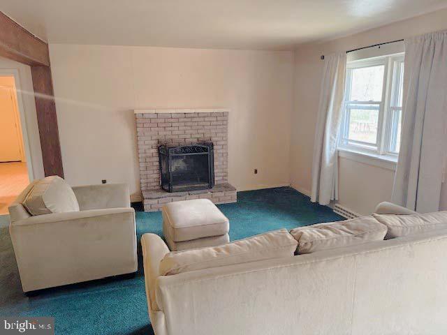 9285 Old Stagecoach Road La Plata, MD 20646 - Photo 7 of 14 a living room with furniture and a fireplace