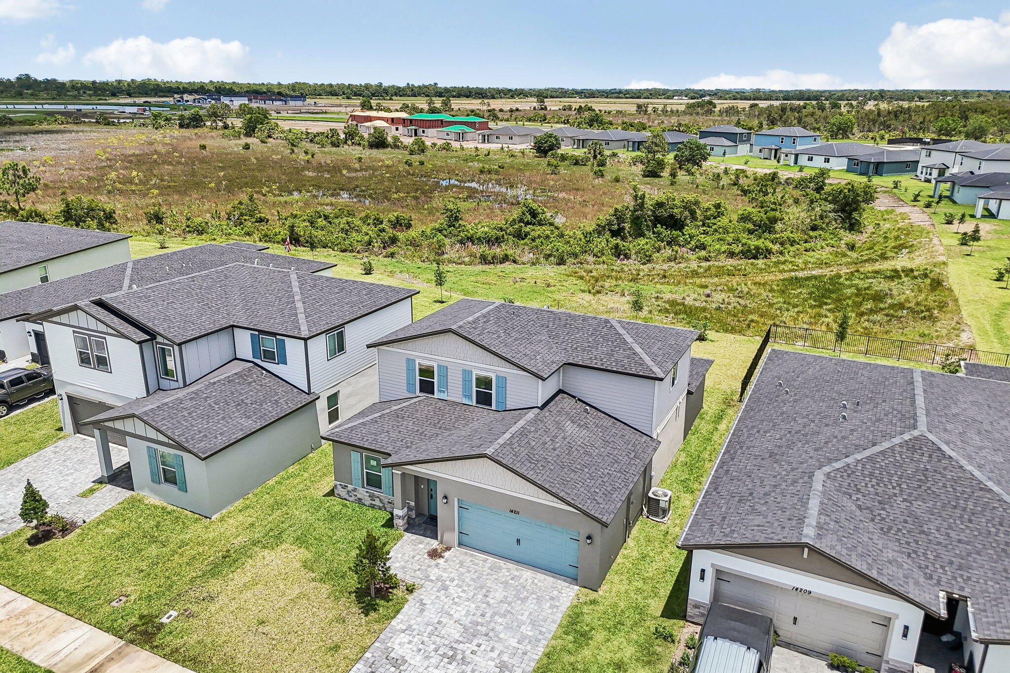 14211 Southwest New Dawn Road Indiantown, FL 34956 - Photo 5 of 37 an aerial view of residential houses with outdoor space and ocean view