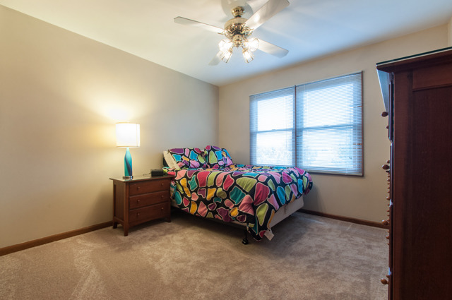 3087 Wagner Road Aurora, IL 60502 - Photo 18 of 20 a bedroom with a bed and a window