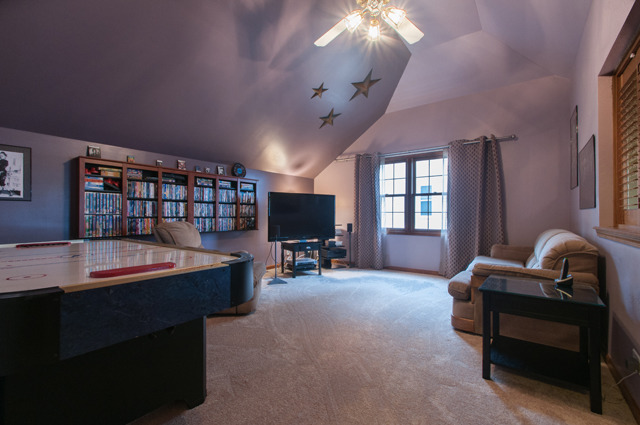 3087 Wagner Road Aurora, IL 60502 - Photo 20 of 20 a room with furniture and a flat screen tv