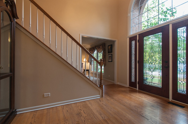 3087 Wagner Road Aurora, IL 60502 - Photo 4 of 20 a view of an entryway with wooden floor and door