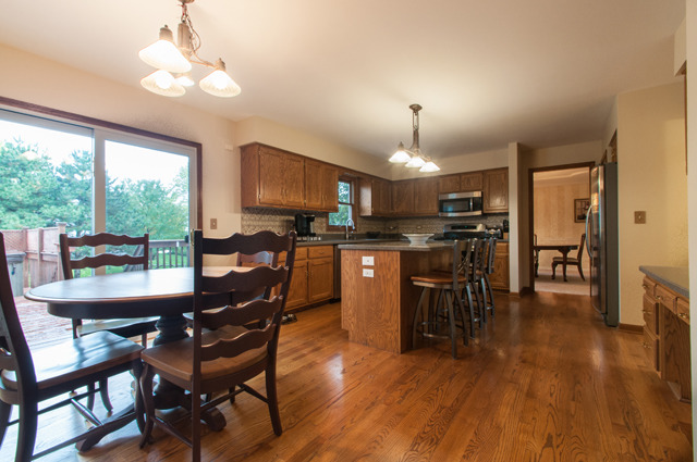 3087 Wagner Road Aurora, IL 60502 - Photo 7 of 20 a view of a dining room with furniture window and wooden floor
