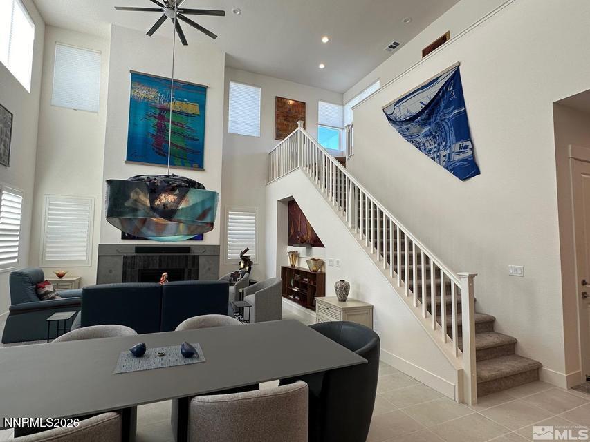 5545 Western Rider Trail Reno, NV 89511 - Photo 11 of 37 a living room with furniture and a flat screen tv