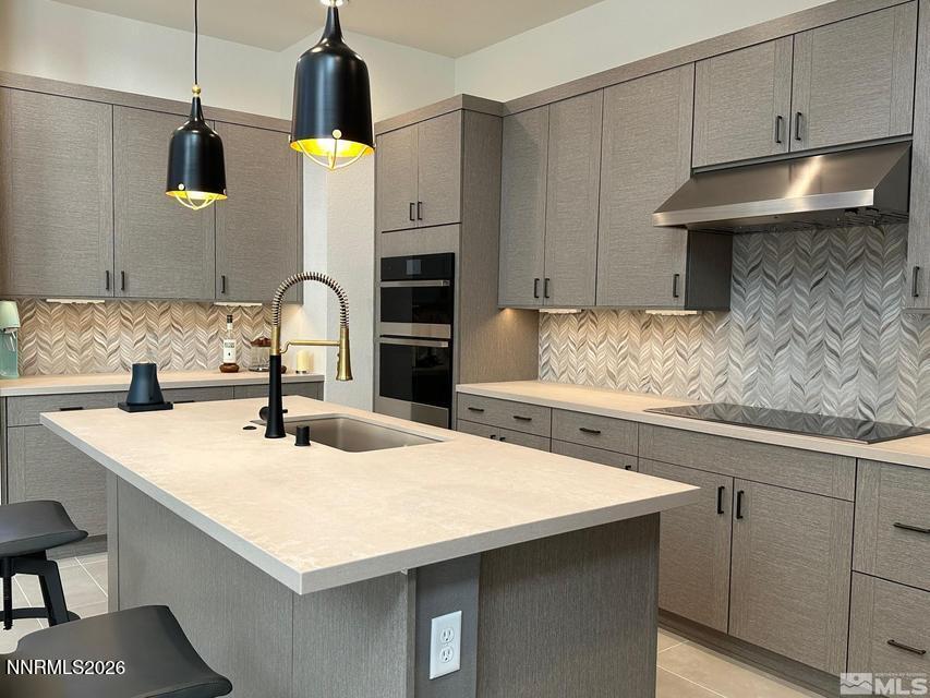 5545 Western Rider Trail Reno, NV 89511 - Photo 2 of 37 a kitchen with a sink a counter space and cabinets
