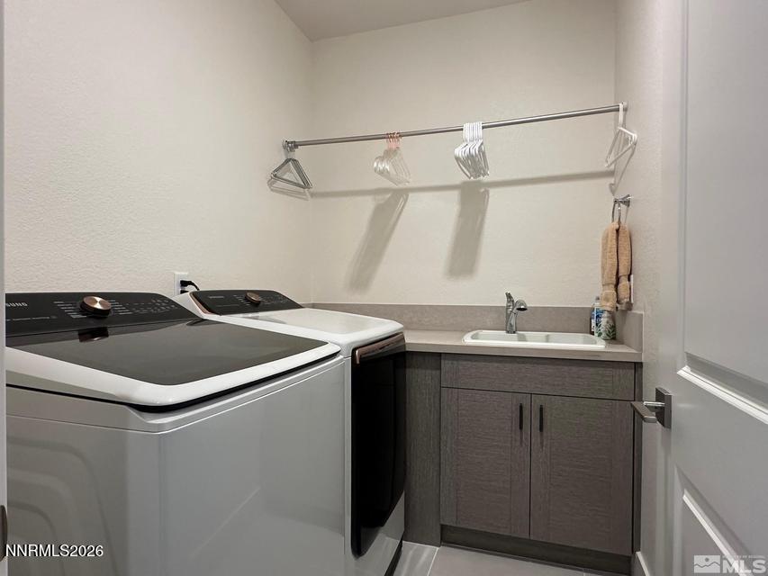 5545 Western Rider Trail Reno, NV 89511 - Photo 23 of 37 a utility room with a sink and dryer