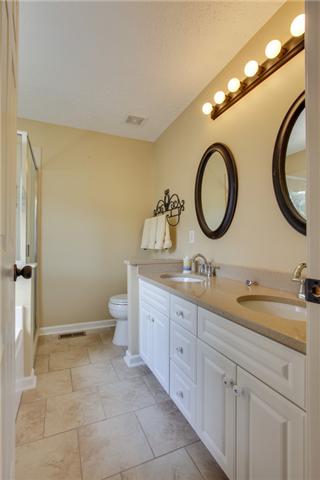 404 Orchid Road Franklin, TN 37064 - Photo 13 of 20 WOW! Check out this master suite bathroom~ granite counters, ceramic tile flooring, upgraded pulls... what more could you ask for?