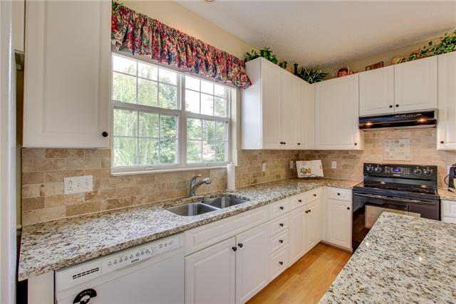 404 Orchid Road Franklin, TN 37064 - Photo 7 of 20 Here is a close up of the newly installed granite and tile backsplash! Isn't it gorgeous?