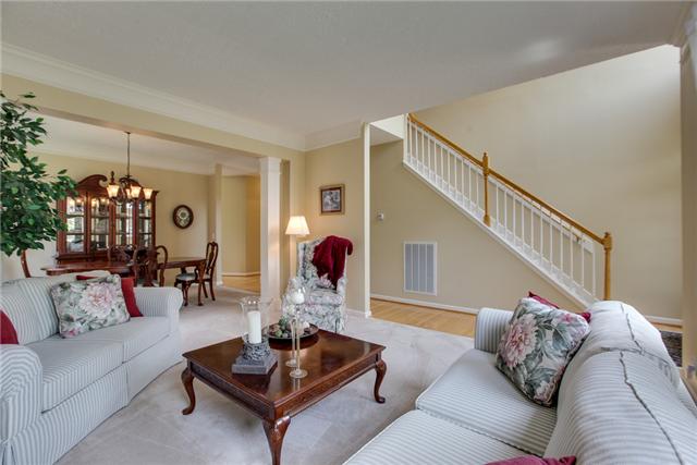 404 Orchid Road Franklin, TN 37064 - Photo 9 of 20 Crown molding, load of light and combined with dining room. Great for entertaining!