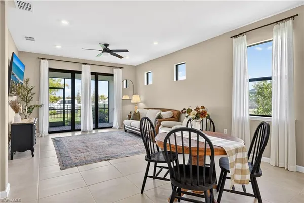 a view of a dining room with furniture window and outside view