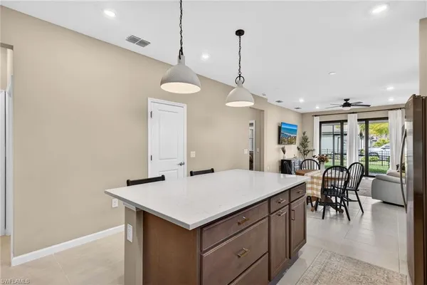 a kitchen with a table and chairs