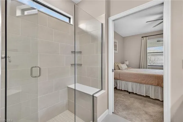 a bathroom with a bathtub and shower