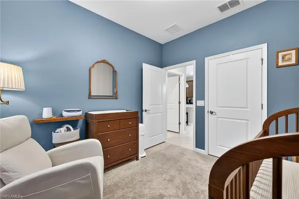 a bedroom with a bed and furniture