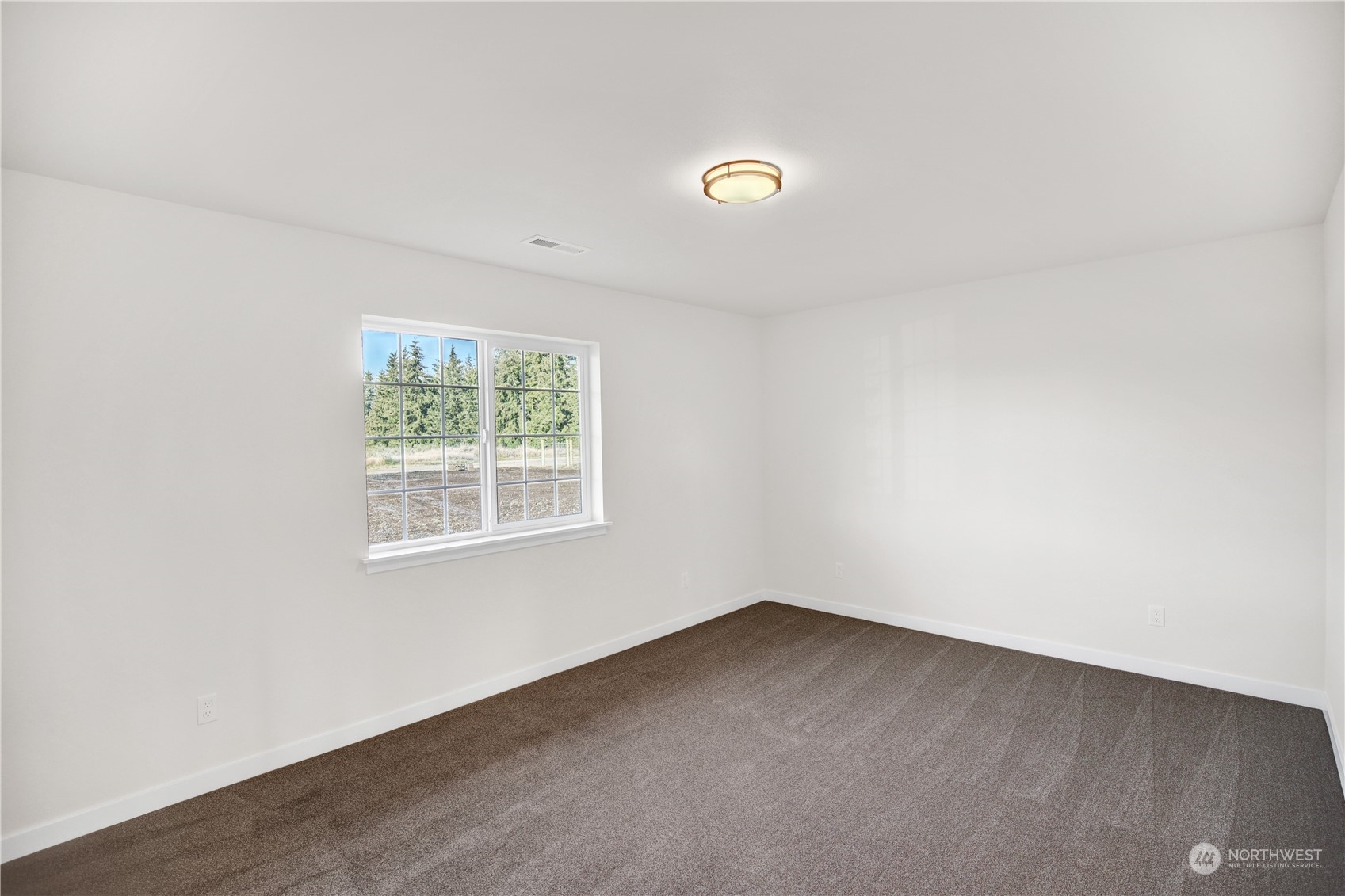 7507 182nd Trail Southwest Rochester, WA 98579 - Photo 11 of 22 an empty room with a window