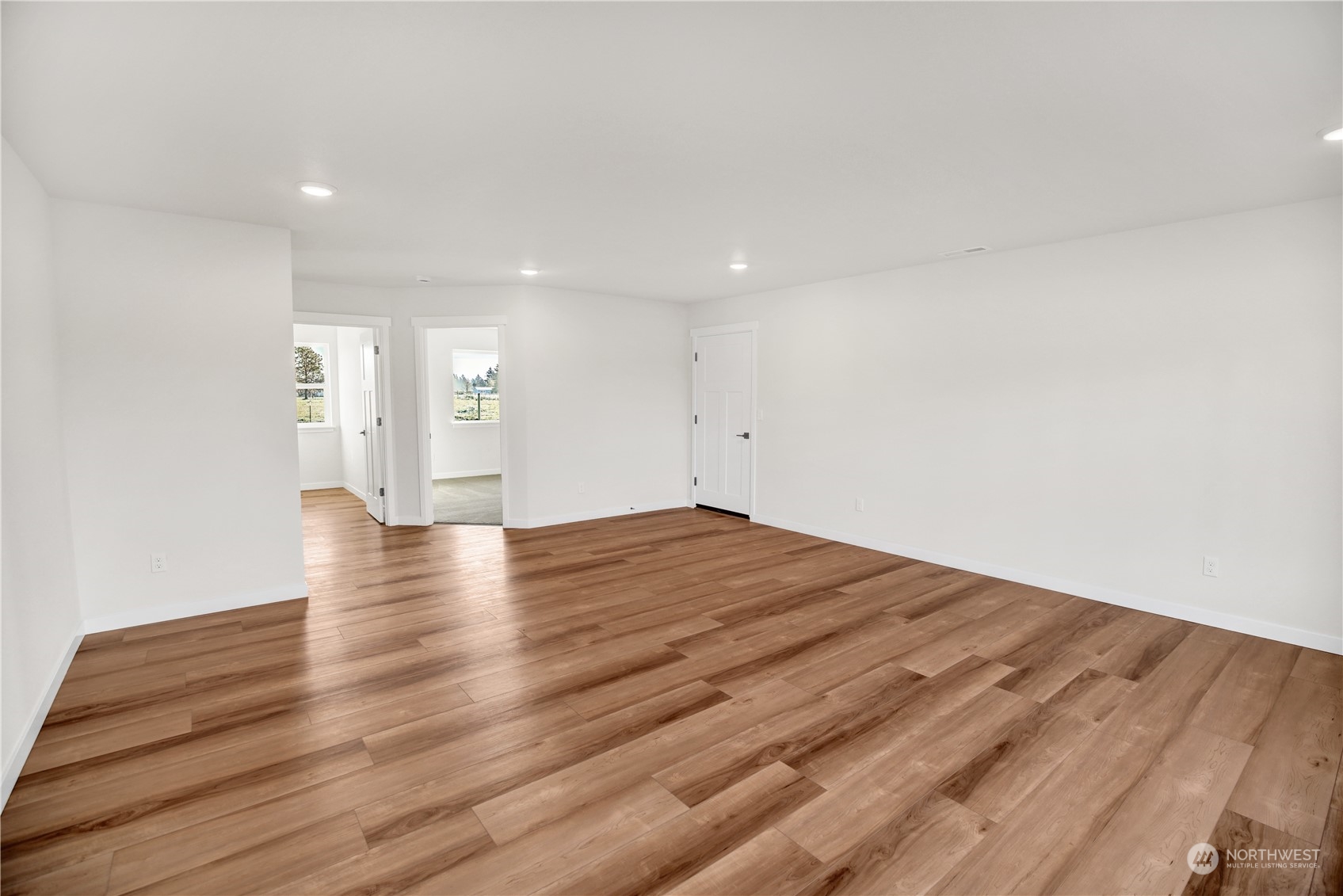 7507 182nd Trail Southwest Rochester, WA 98579 - Photo 19 of 22 a view of empty room with wooden floor