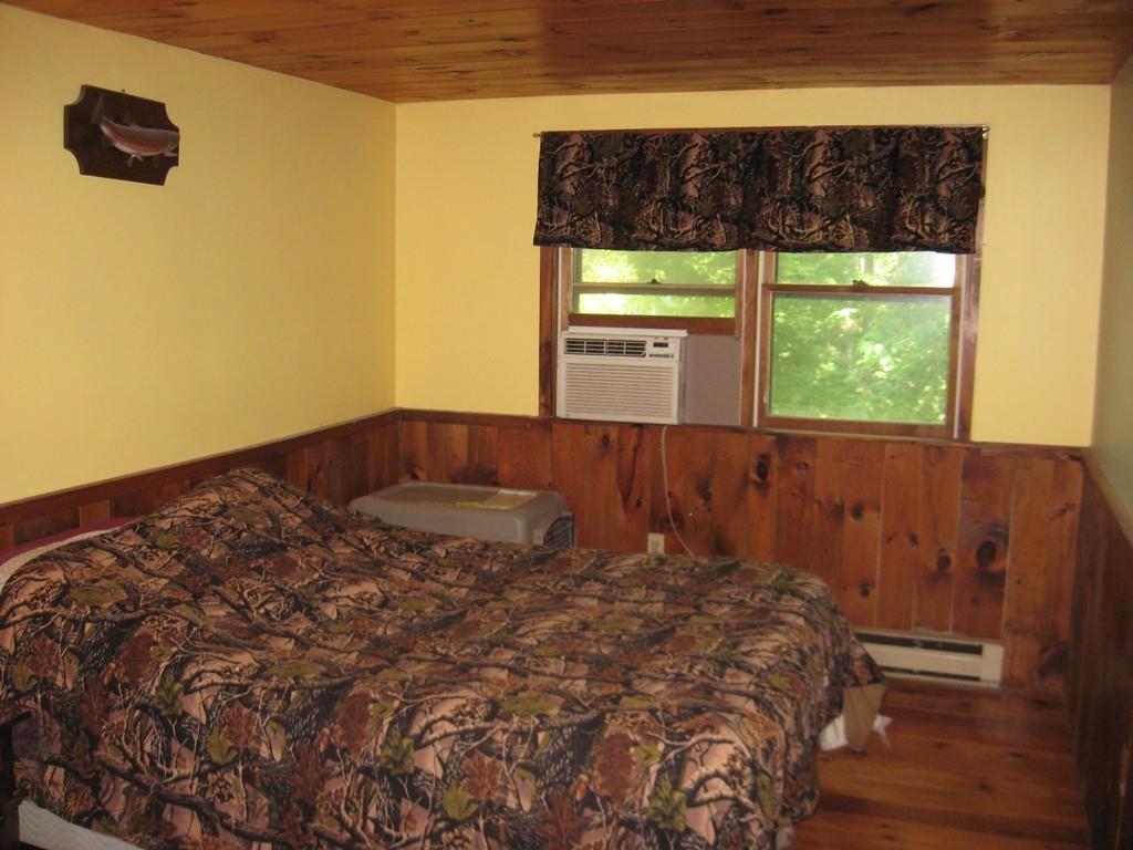 229 White Pond Road Athol, MA 01331 - Photo 36 of 42 a bed sitting in a bedroom next to a window