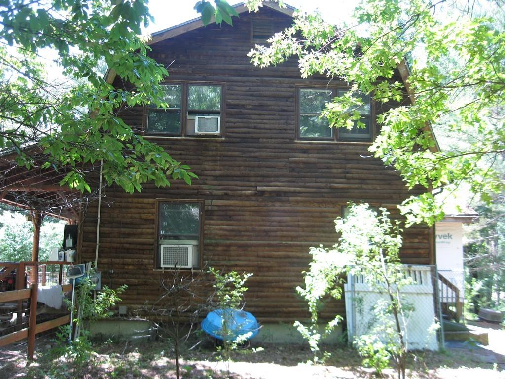 229 White Pond Road Athol, MA 01331 - Photo 4 of 42 a view of a brick house with a flower garden
