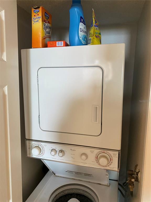 6035 Sea Ranch Drive, Unit 901 Hudson, FL 34667 - Photo 17 of 72 a utility room with dryer and washer