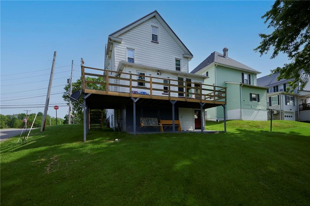 500 West Main Street Rural Valley, PA 16249 - Photo 33 of 41 a front view of a house with a garden and deck