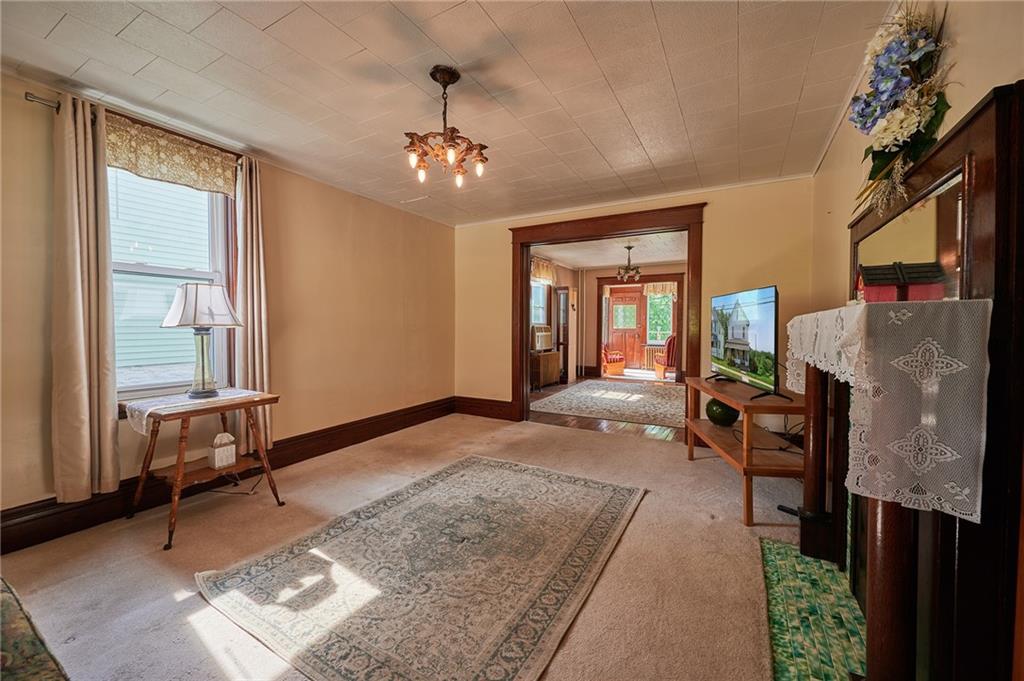 500 West Main Street Rural Valley, PA 16249 - Photo 7 of 41 a living room with furniture and a chandelier