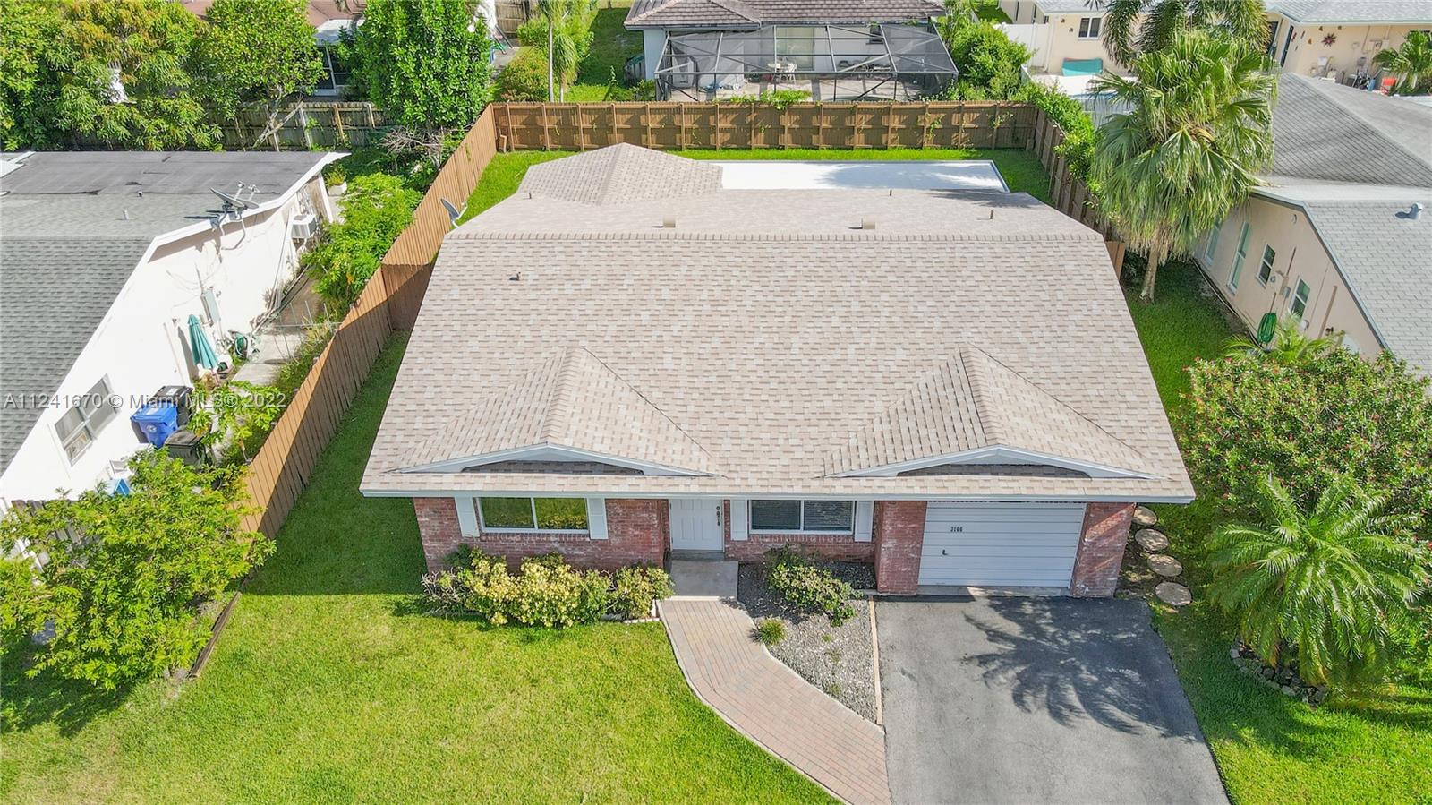 3166 Northwest 68th Court Fort Lauderdale, FL 33309 - Photo 3 of 36 a aerial view of a house with a yard