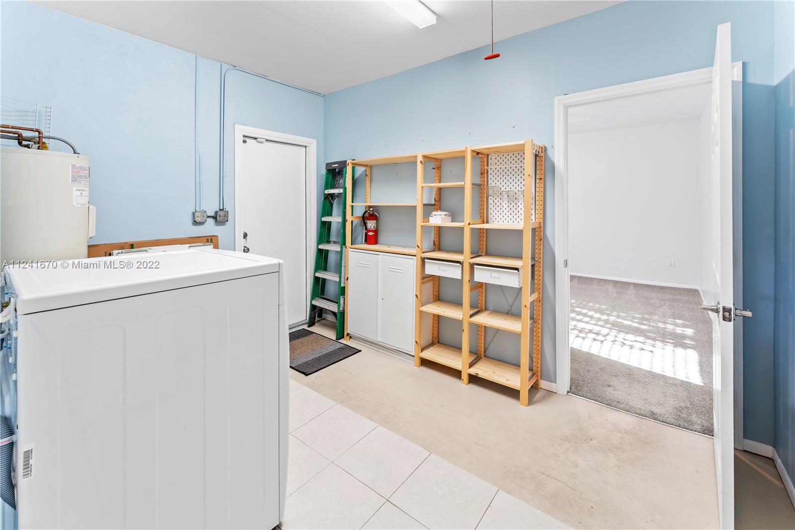 3166 Northwest 68th Court Fort Lauderdale, FL 33309 - Photo 31 of 36 a view of walk in closet with empty racks