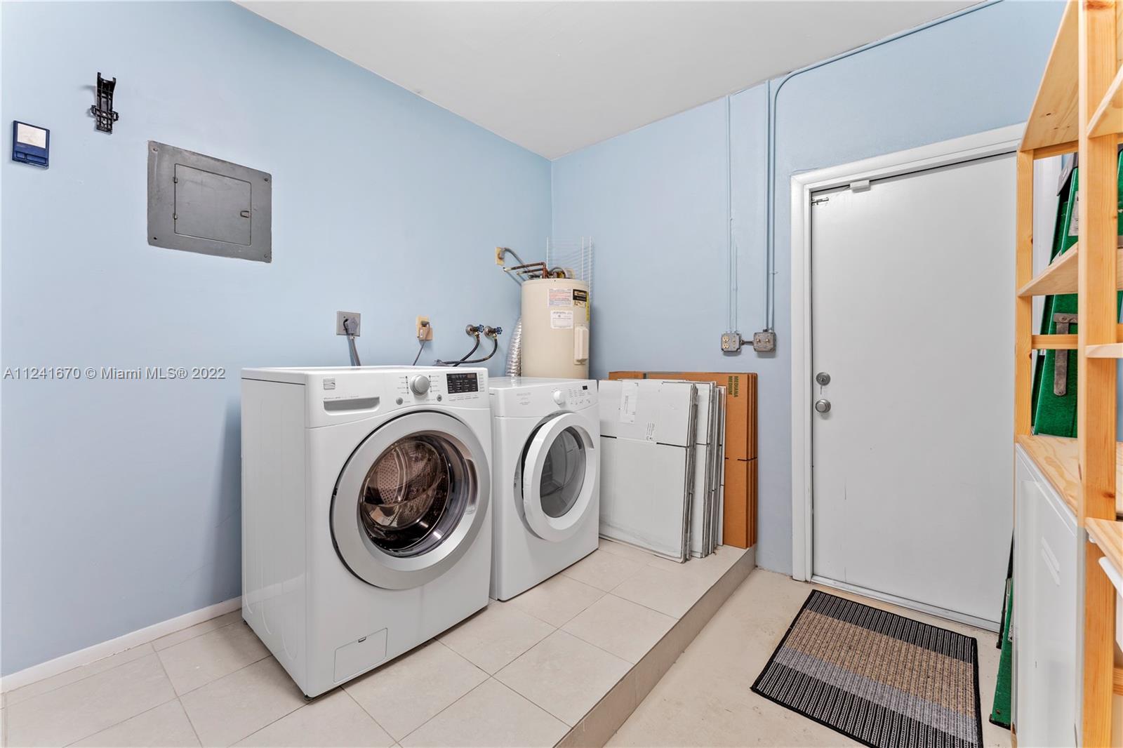 3166 Northwest 68th Court Fort Lauderdale, FL 33309 - Photo 32 of 36 a utility room with dryer and washer
