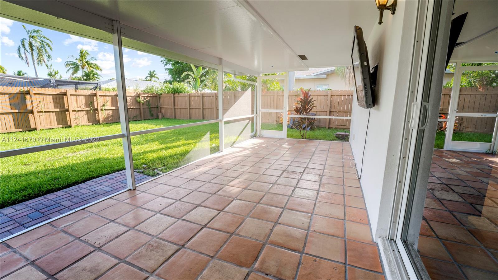 3166 Northwest 68th Court Fort Lauderdale, FL 33309 - Photo 36 of 36 a view of a back yard from a living room