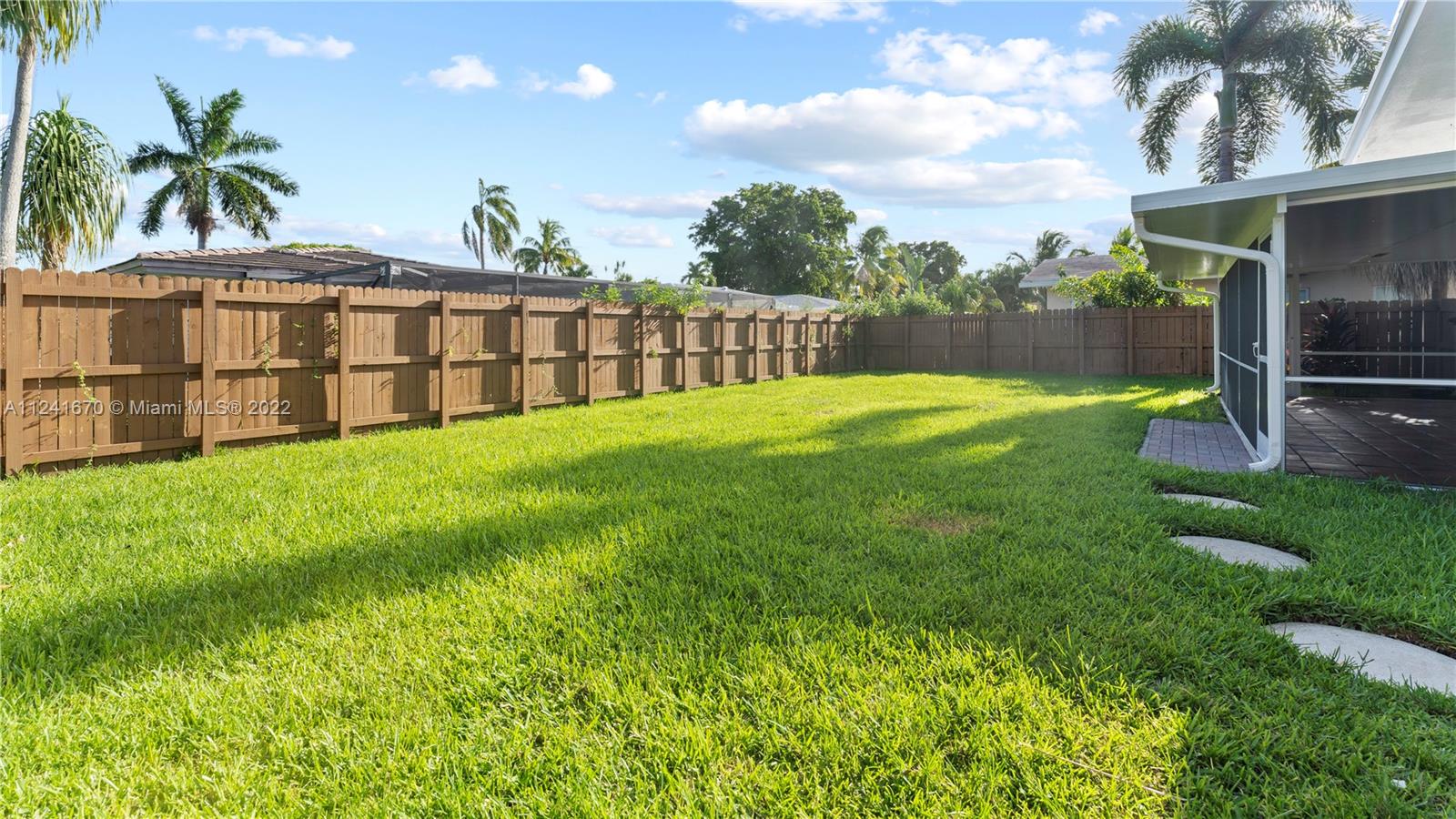 3166 Northwest 68th Court Fort Lauderdale, FL 33309 - Photo 10 of 36 a view of a porch with a yard